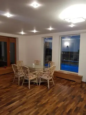 a dining room with a table and chairs at Lucky 55 in Prague
