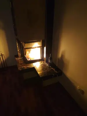 an overhead view of an oven with a fire in it at Lucky 55 in Prague