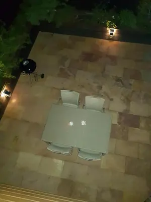 an overhead view of a table with chairs and a grill at Lucky 55 in Prague