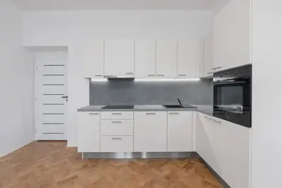 a bedroom with a bed and a window at Simple and Cozy in Prague