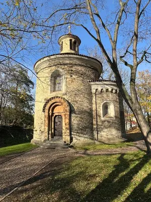 an entrance to a brick wall with an archway at Simple and Cozy in Prague