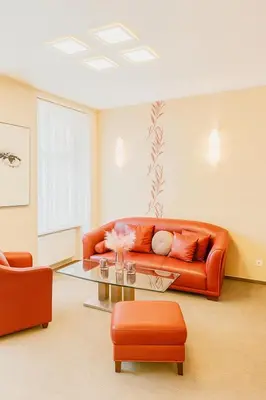 a living room with a couch and a table at Maisonette apartment in the center of Prague - Samcova in Prague