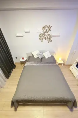 a bedroom with a large bed in a room at Exclusive Apartment with Terrace, View & Jacuzzi in Prague