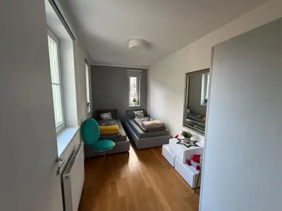 a living room with a couch and a chair at Riverside Grande in Prague