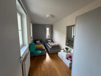a living room with a couch and a chair at Riverside Grande in Prague