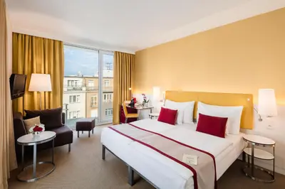 a hotel room with a large bed and a large window at OREA Hotel Andels Depandance in Prague
