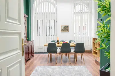 a dining room with a table and four chairs at Cozy Central Two-Bedroom Apartment in Prague