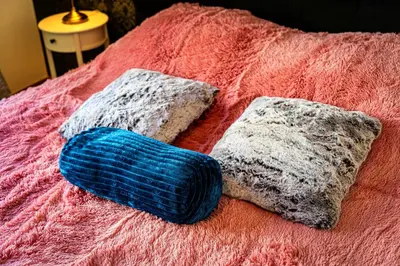 two pillows sitting on top of a bed at Hound Deluxe Suite in Prague