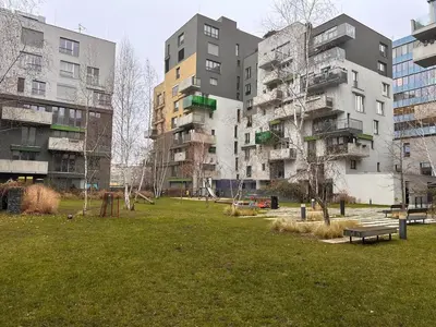 a park in front of some tall buildings at Evas Cozy Studio Prague in Prague