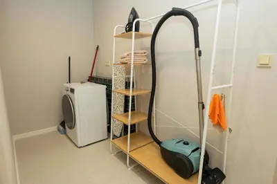 a bathroom with a blow dryer and a shower at Prague City Center 99m2 Andel Family Apartment for 6 Bath and Shower Self Check in in Prague
