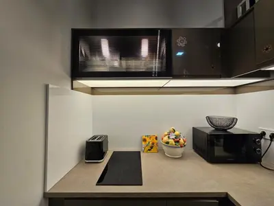 a kitchen with a counter top with a microwave and a microwave at Bohemian Loft Apartament in Prague