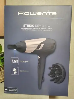 a box with a hair dryer and other tools on it at Bohemian Loft Apartament in Prague