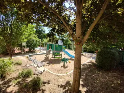 a park with a playground with a slide at 2 - room apartment with terrace and free parking in Prague