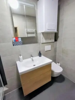 a bathroom with a sink and a toilet at 2 - room apartment with terrace and free parking in Prague