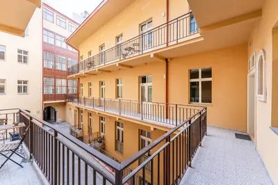 an empty balcony of an apartment building at Rentero Central Apartment near Charles Square in Prague