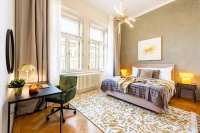 a bedroom with a bed and a desk and a desk at Prague Days - Four Bedroom Apartment with Workspace and 250Mbs WiFi in New Town in Prague