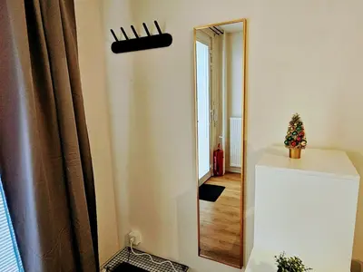 a mirror on a wall with a christmas tree on a counter at SUPERIOR PRAGUE 2BR APARTMENT for Business & Leisure, Private Garden, Free Parking & Gym, by LIVE-INN 1 in Prague