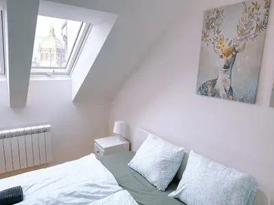 a bedroom with a bed and a window at Central Apartment by National Museum&Wenceslas Square in Prague