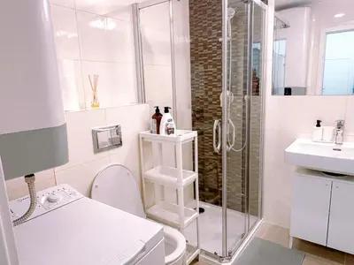 a bathroom with a shower and a toilet and a sink at Central Apartment by National Museum&Wenceslas Square in Prague