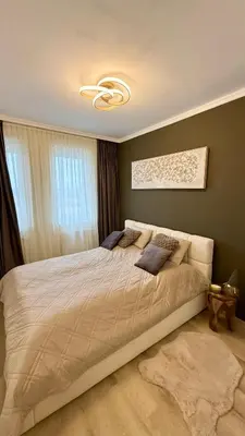 a bedroom with a large bed with a ceiling at Brownie Prague Design Apartment, free garage parking in Prague