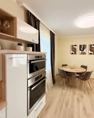 a kitchen counter with a coffee maker and a toaster at Brownie Prague Design Apartment, free garage parking in Prague