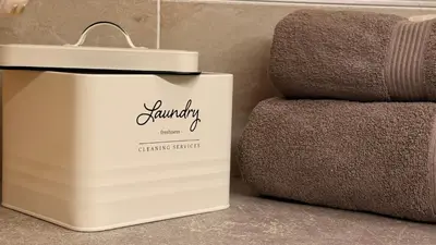 a pile of towels sitting on top of a bed at Brownie Prague Design Apartment, free garage parking in Prague