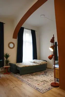 a bedroom with a bed in front of a window at Prague Properties Rental in Prague