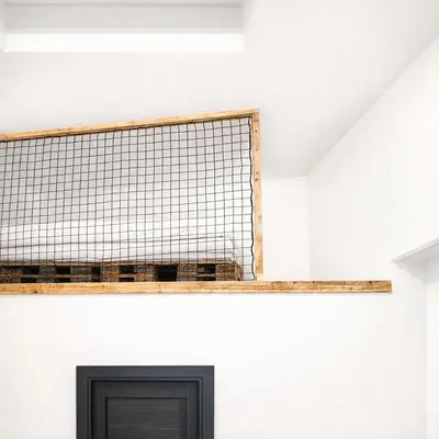 a shelf above a door on a white wall at Ubytování Městská hora Beroun - Sauna in Beroun