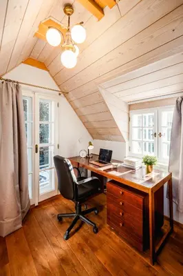 an office with a desk with a computer on it at Prague Days - Cozy House near Prague Castle with Desk and Balcony in Prague