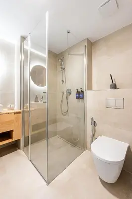a bathroom with a shower and a toilet at Prague Days - One Bedroom Apartment with Garage and Workspace in Prague