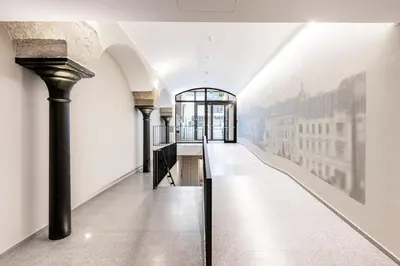 a hallway in a building with a painting on the wall at Prague Days - One Bedroom Apartment with Garage and Workspace in Prague