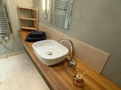 a bathroom with a white sink and a mirror at River Diamond Central Residence in Prague