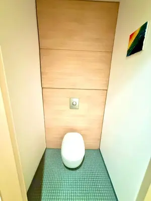 a small bathroom with a toilet in a room at River Diamond Central Residence in Prague