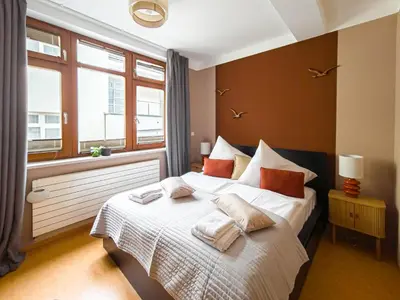 a bedroom with a bed with towels on it at Triplex Apartment with Private Terrace in Prague