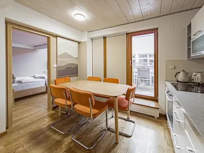 a kitchen and dining room with a table and chairs at Triplex Apartment with Private Terrace in Prague