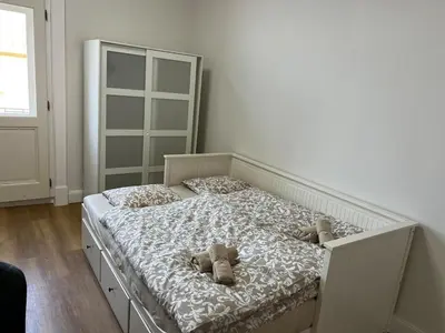 a bedroom with a bed with teddy bears on it at Quiet Apartment Farmers' Saturday Market in Prague