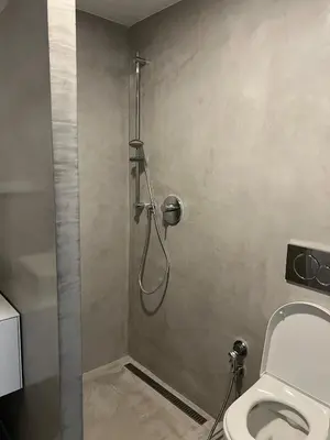 a shower stall in a bathroom with a toilet at Quiet Apartment Farmers' Saturday Market in Prague