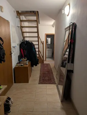 a hallway with a staircase and a room with a rug at Cozy Studio-Room Near center with Private Bathroom in Prague