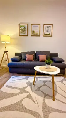 a living room with a couch and a table at Prague 1 - Central Cozy Apartment in Prague