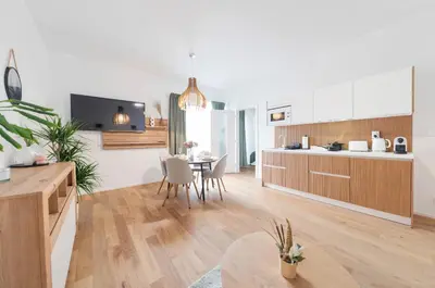 a kitchen and dining room with a table and chairs at Kajetanka Residence - with free weekend parking in Prague