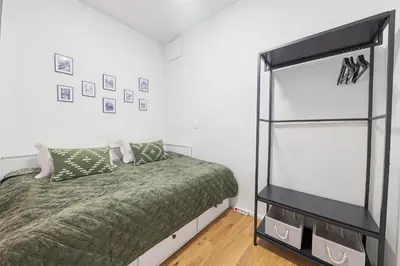 a bedroom with a bed and a mirror at Kajetanka Residence - with free weekend parking in Prague