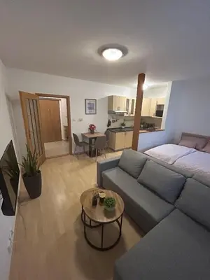 a living room with a couch and a table at Eleven Břevnov in Prague