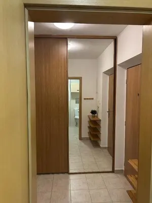 a hallway with a door leading to a bathroom at Eleven Břevnov in Prague
