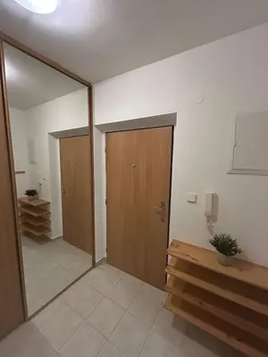 an empty room with a door and a mirror at Eleven Břevnov in Prague