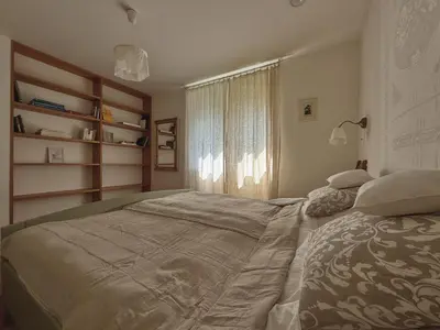 a bedroom with a large bed and a window at 4borovice in Velká Lečice