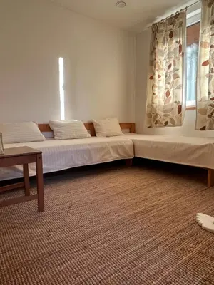 a bedroom with two beds and a window at 4borovice in Velká Lečice