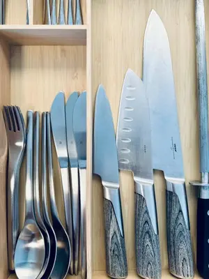 a row of knives and utensils in a drawer at Prague Anděl Quiet Comfy apartment in Prague