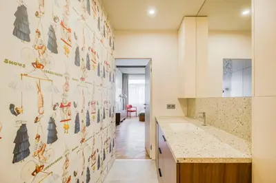 a kitchen with a wall with animals on it at Boutique Studio just 5 min from Wenceslas Square by Gravity Prague in Prague