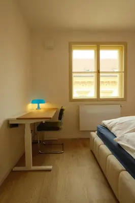 an empty hallway with a door and a light at ChlumovaNest Apartment in Žižkov, close to the city center in Prague