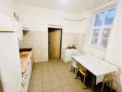 a kitchen with a table and a sink at Big apartment in Brandýs nad Labem in Brandýs nad Labem-Stará Boleslav